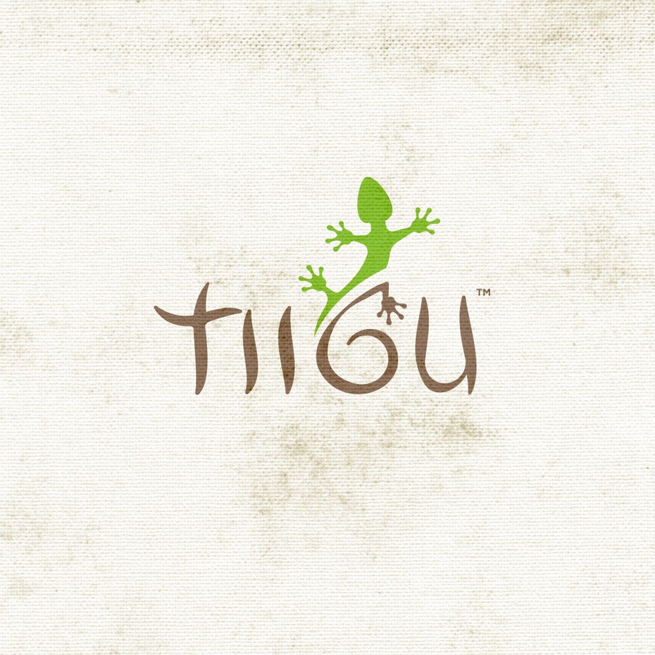 minimalist wordmark  logo  that says “TIIGU” with a lizard crawling above the G